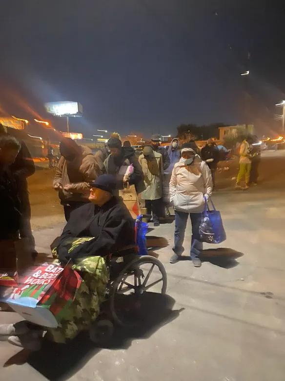 People in line waiting to be fed